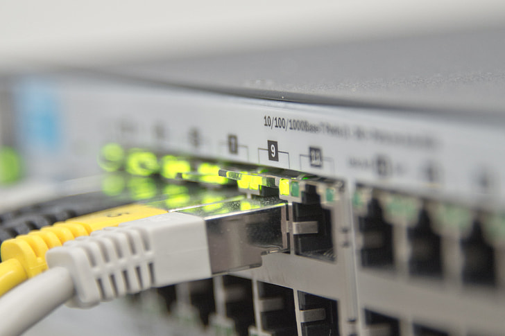 closeup photo of patch panel with cords