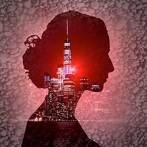silhouette of woman and high rise buildings