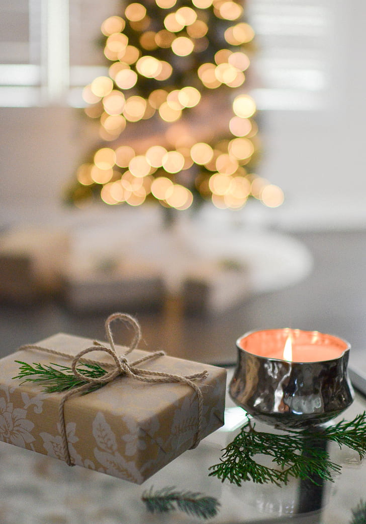 Close-Up Photography of Gift Besides Candle