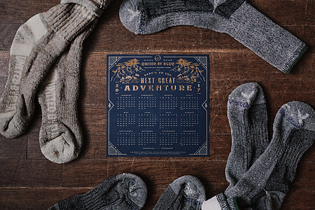 four pairs of gray socks with calendar
