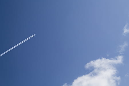 Jet Under Clear Blue Sky during Daytime