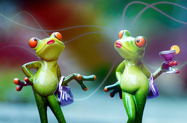 two green frogs holding bag and martini glass
