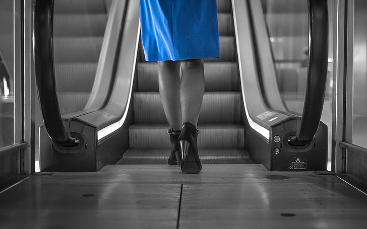 selective color photography of woman in blue dress