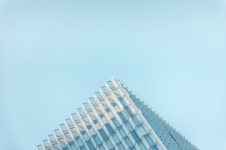 glass window skyscraper building under clear blue sky during daytime