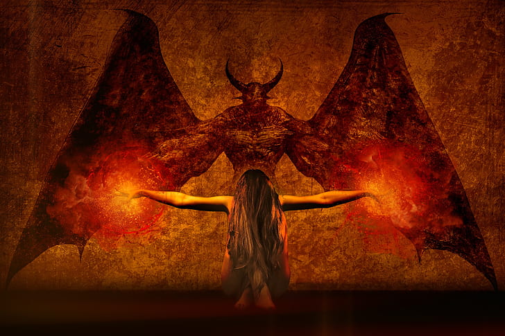 woman kneeling in front of demon artwork