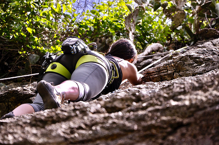 Royalty-Free photo: Person climbing on rocky wall | PickPik