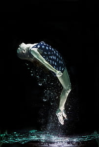 under water photo of woman wearing polka-dot dress