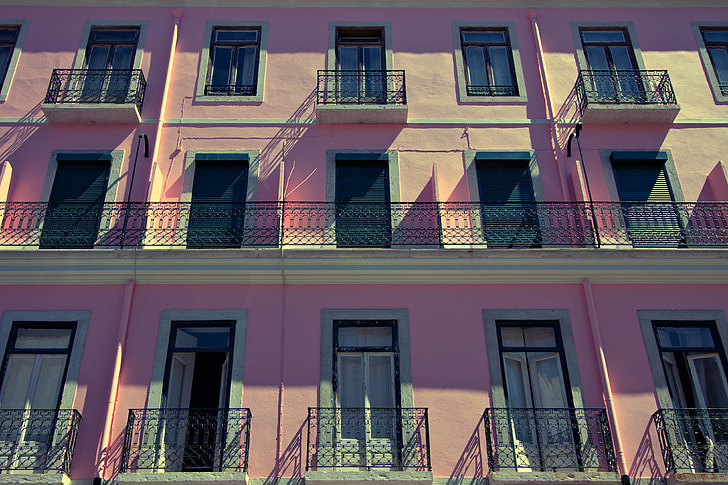 Wide-angle shot of a pink-coloured building in Lisbon, Portugal