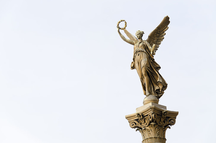 angel wearing dress statue