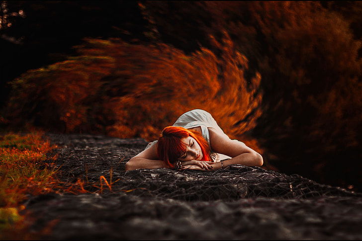 A woman lying down in the Autumn