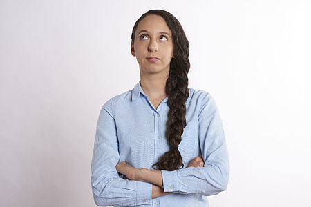 woman braided hair wearing blue button-up long-sleeved shirt