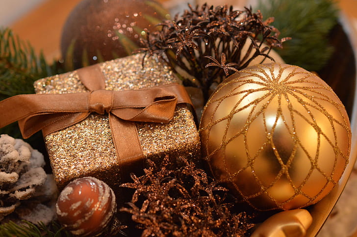 close-up of gold-colored bauble and glittery box