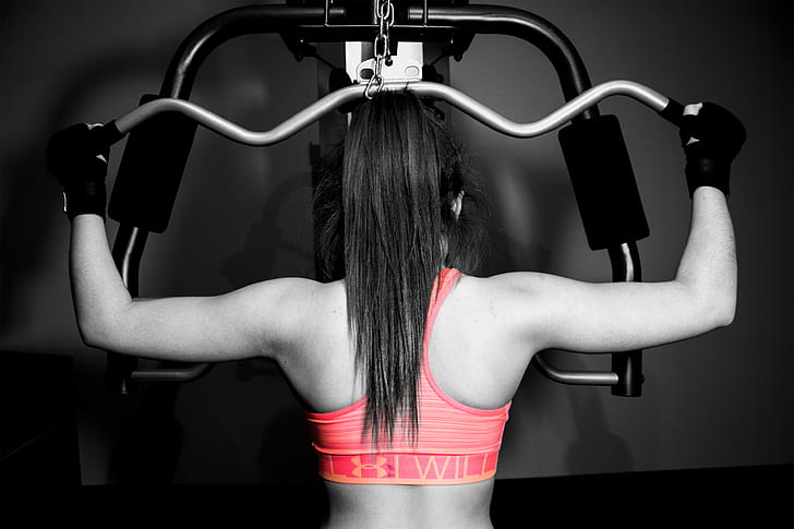 selective color photography of woman in pink sport bra