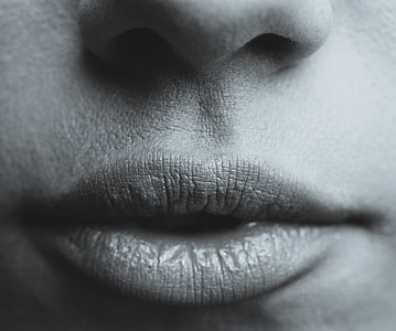 grayscale close-up photography of human lips