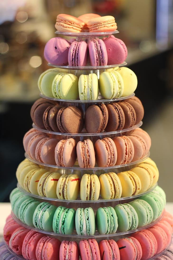assorted-color of macarons on clear glass 8-tier tray