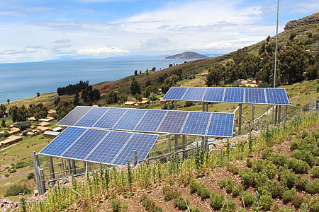 solar panels on green grass field