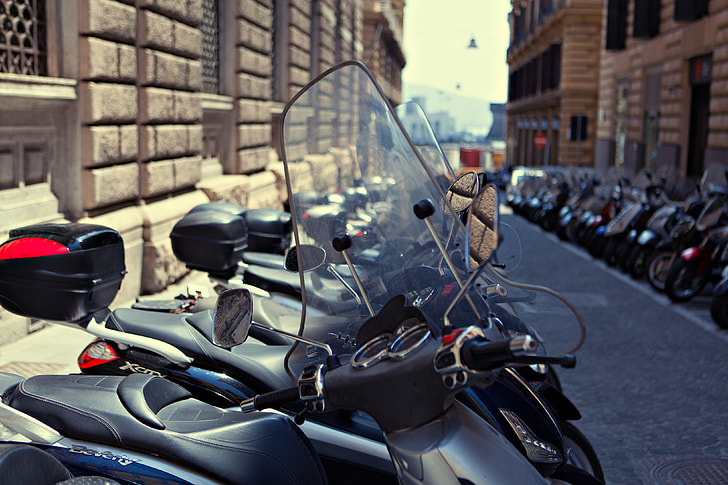 A long row of motorbikes line-up in Napoli, Italy