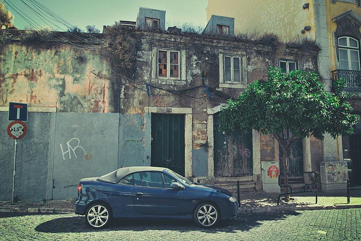 Street shot of a car sitting on an old back street in Lisbon, Portugal, image captured with a Canon DSLR