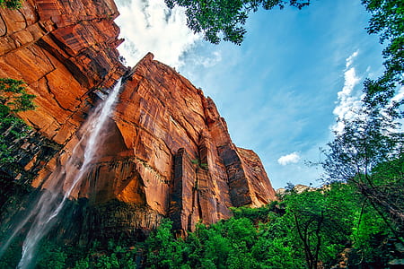 waterfalls between rock mountain during daytime