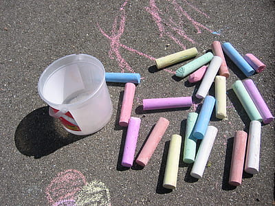 photo of assorted-color chalks on floor