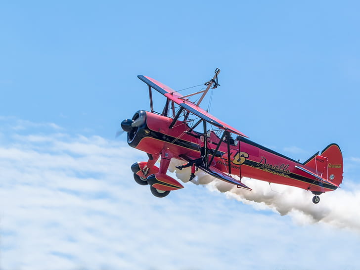 red and black biplane