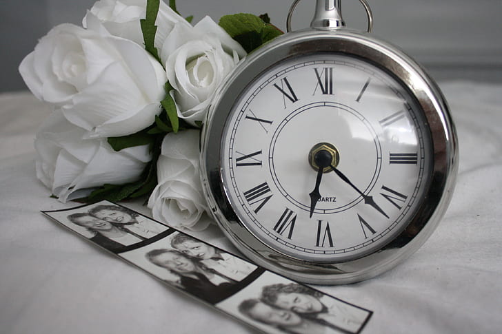 round silver-colored analog clock