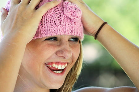 woman wearing pink beanie hat