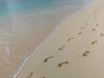 foot trails in beach sand