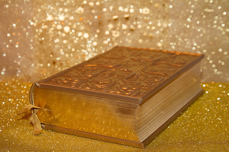 Bible on gold surface
