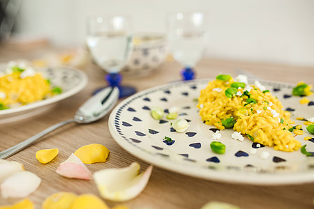 Risotto with broad bean on a cute plate with blue hearts