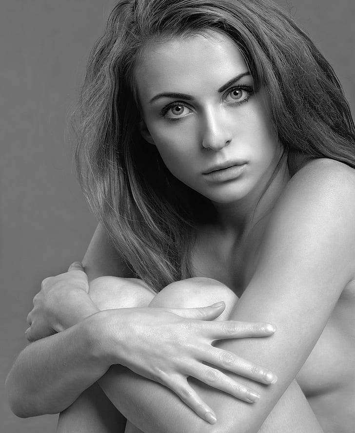grayscale photo of sitting topless woman