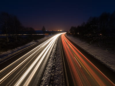 time lapse photography of running vehicles during night time