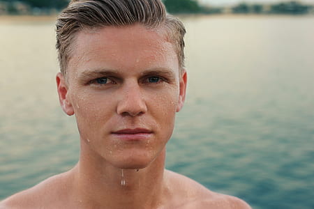 man with blond hair with water dripping from his chin