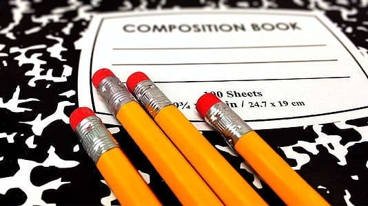 close up photo of four orange pencils