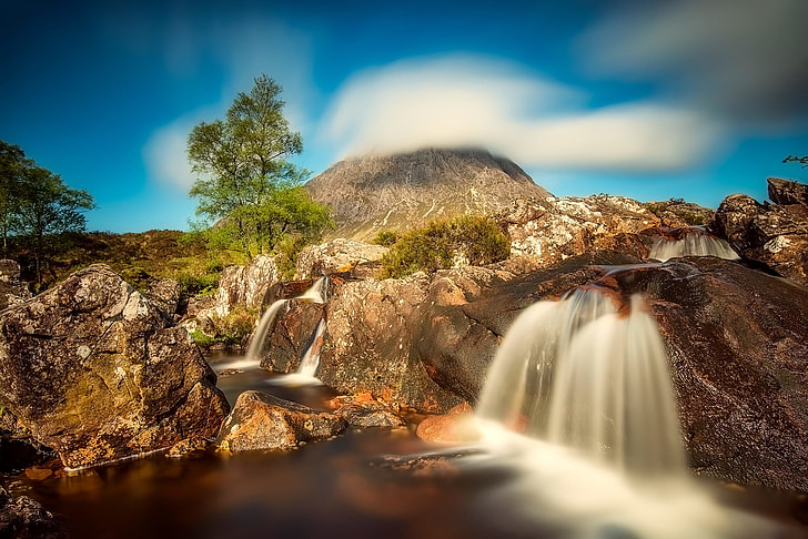 high-saturated photo of waterfalls