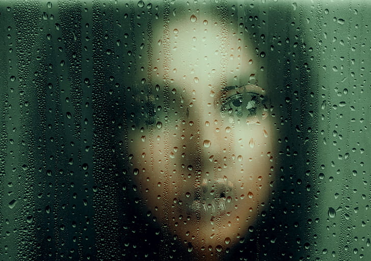 photo of woman in frosted glass