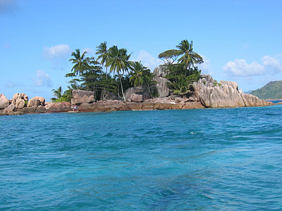 landscape shot of brown island under blue sky