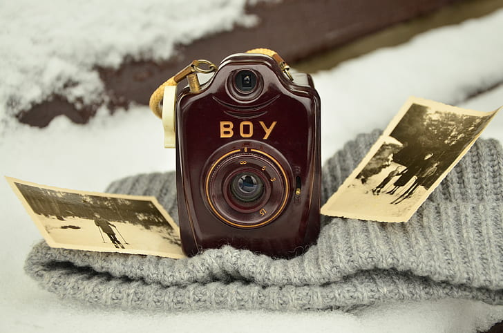 closeup photo of brown Boy camera on knit cap