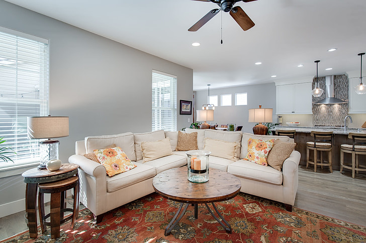 white leather corner sofa on area rug inside house