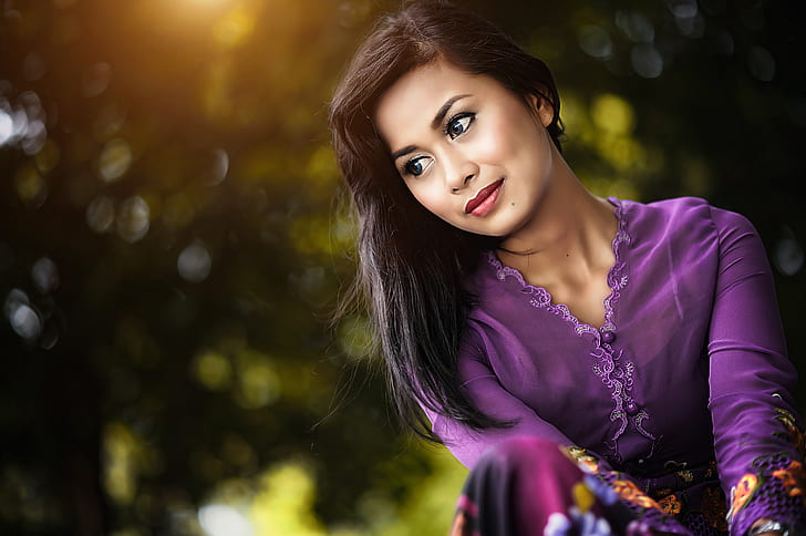 selective focus photography of woman in purple v-neck long-sleeved dress