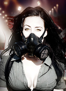 portrait photograph of woman wearing gas mask