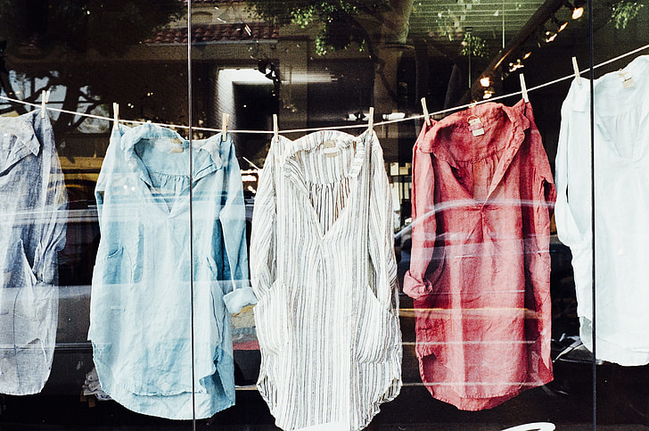 five assorted-style shirts hanged