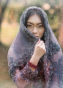 photo of woman wearing purple floral shawl