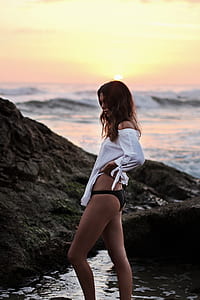 woman wearing white long-sleeved top and black panty