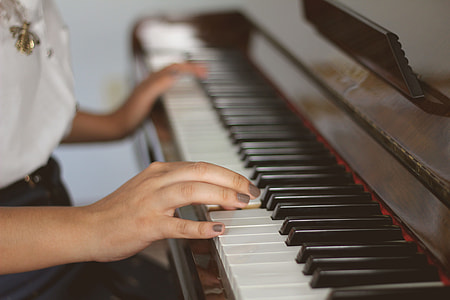 Closeup shot of a person playing the piano