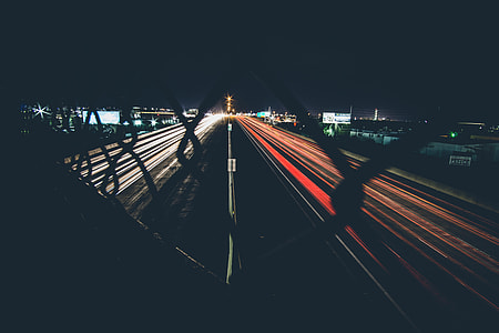 photo of high speed car lights during night time