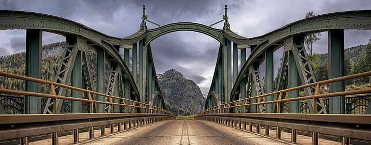grey concrete bridge near mountains
