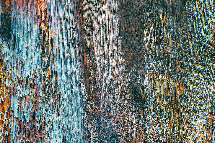 Closeup shot of fading paint of multiple colours, image captured with a Canon DSLR