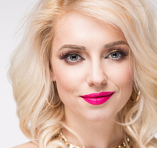 woman in pink lipstick closeup photography