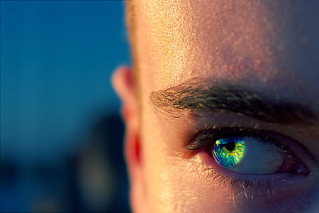 person with blue and green eyes